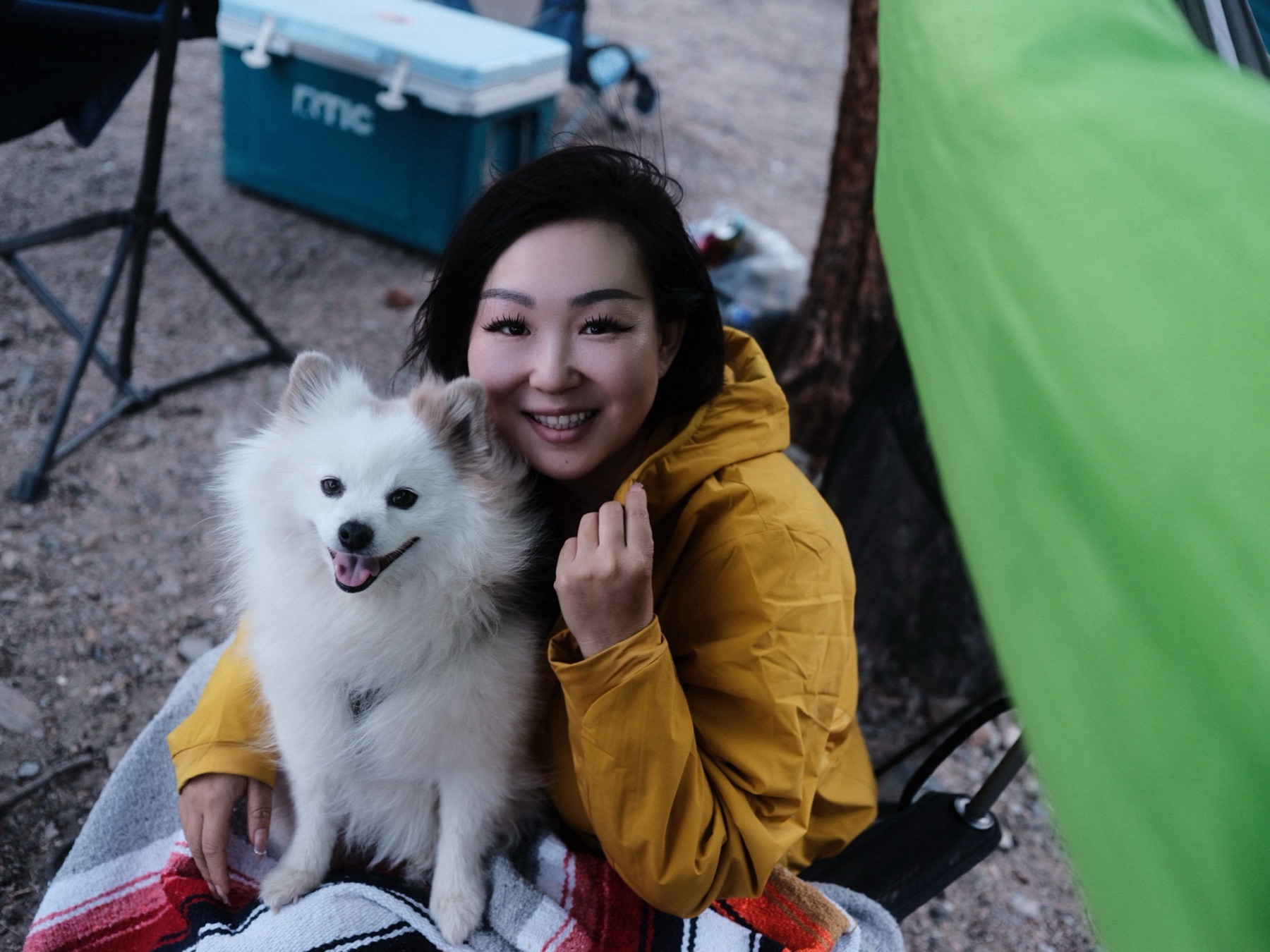 Xin Liu outdoors with her dog
